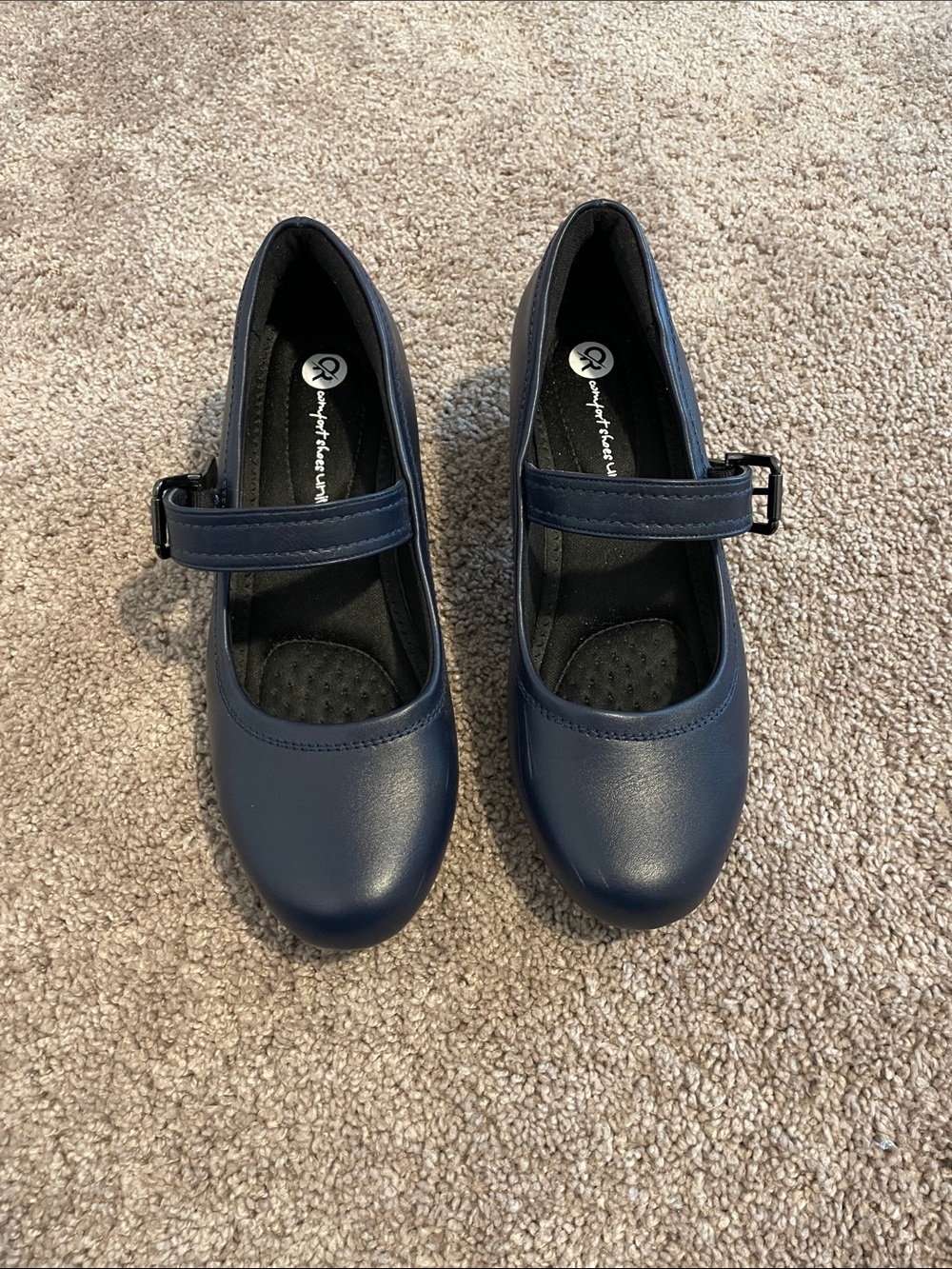 Women’s navy blue comfort shoes with adjustable strap